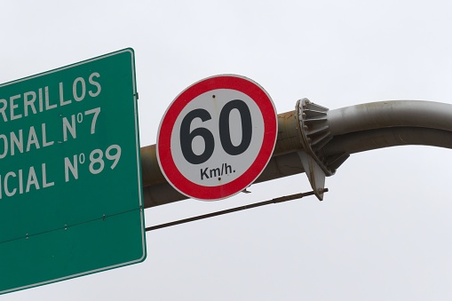 Road sign showing the speed limit in the metric system.