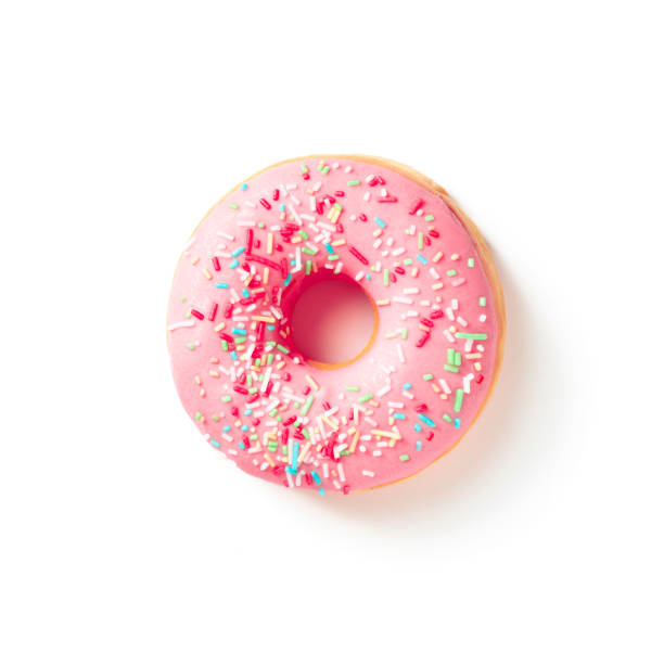 istock Sweet donut in colored pink glaze on a white background top view 1496927266