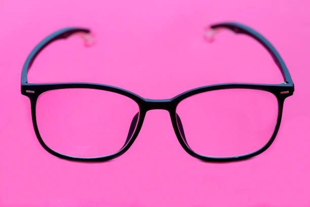 istock glasses with black frames isolated on pink 1496927752