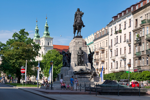 Krakow, Poland - June 06 2019: The Grunwald Monument (Polish: Pomnik Grunwaldzki) is an equestrian statue of King of Poland Wadysaw II Jagieo located at Matejko Square in Kraków's Old Town and created by Antoni Wiwulski in 1910 to commemorate the 500th anniversary of the Battle of Grunwald.