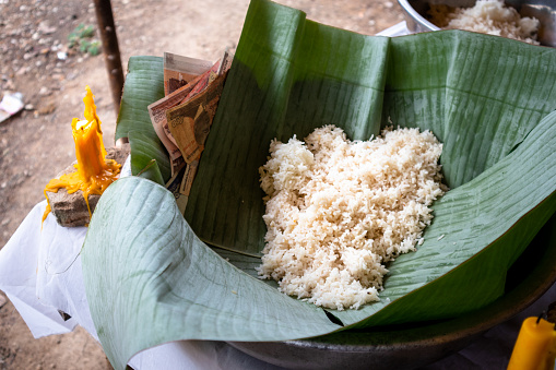 The rice on the banana leaf for the pitra. The rice donated for ghost during Pchum Ben.