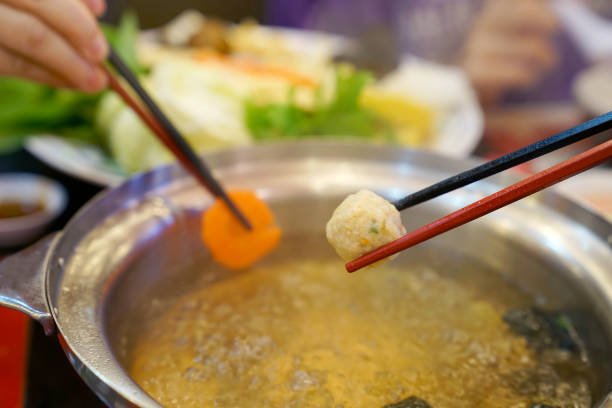 istock chopsticks holding meat ball in restaurant 1496933214