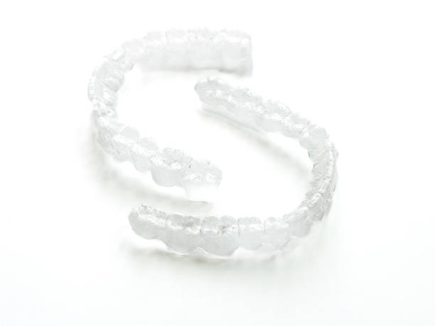 istock Pair of invisible splints for orthodontic treatment isolated on white 1496934935