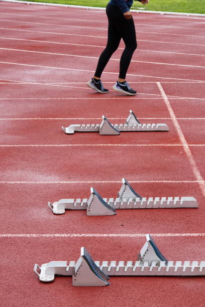istock Tartan running track for athletic events with starting blocks 1496935104