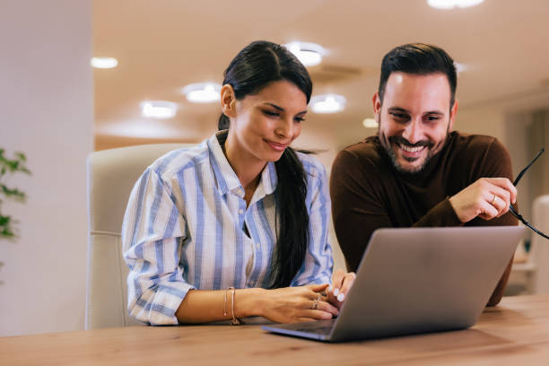 istock Colleagues working together over the laptop at the office. 1496936114