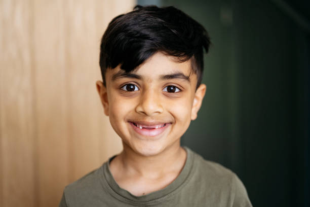istock Headshot of smiling young boy 1496936271