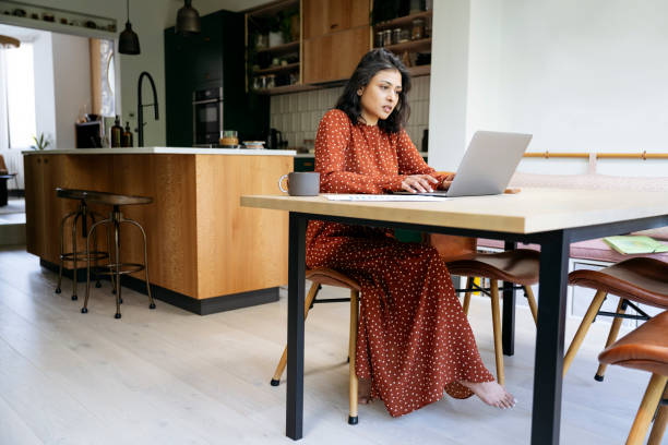 istock Early 40s corporate professional working at home 1496936295