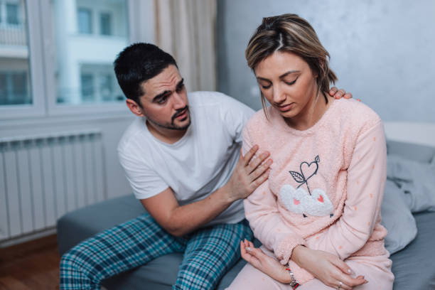 istock Man offering support and talking to his wife 1496936492
