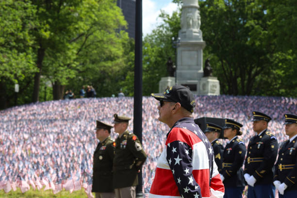Vietnam Veteran at Boston Memorial Day Ceremony Vietnam veteran at Memorial Day ceremony, background are 37.000 U.S. flags and Soldiers and Sailors Monument on Boston Common,U.S. May 25, 2023. proud army mom stock pictures, royalty-free photos & images
