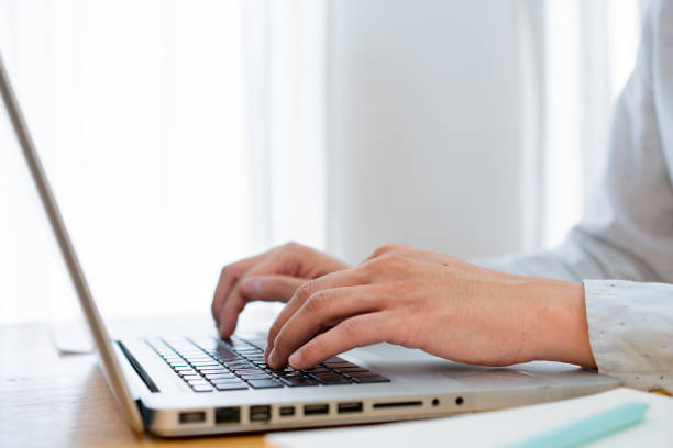 istock Hands type on the computer, keyboard. Work in the office or at home at the computer Generative AI. Man hands typing laptop keyboard at desk close up. Businessman using computer. 1496939636