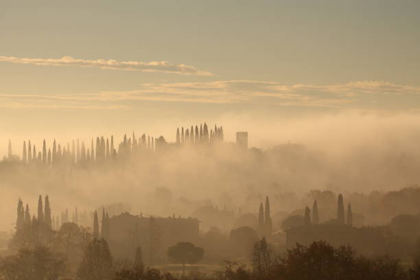 View on Garda lake in a foggy day in winter at sunrise