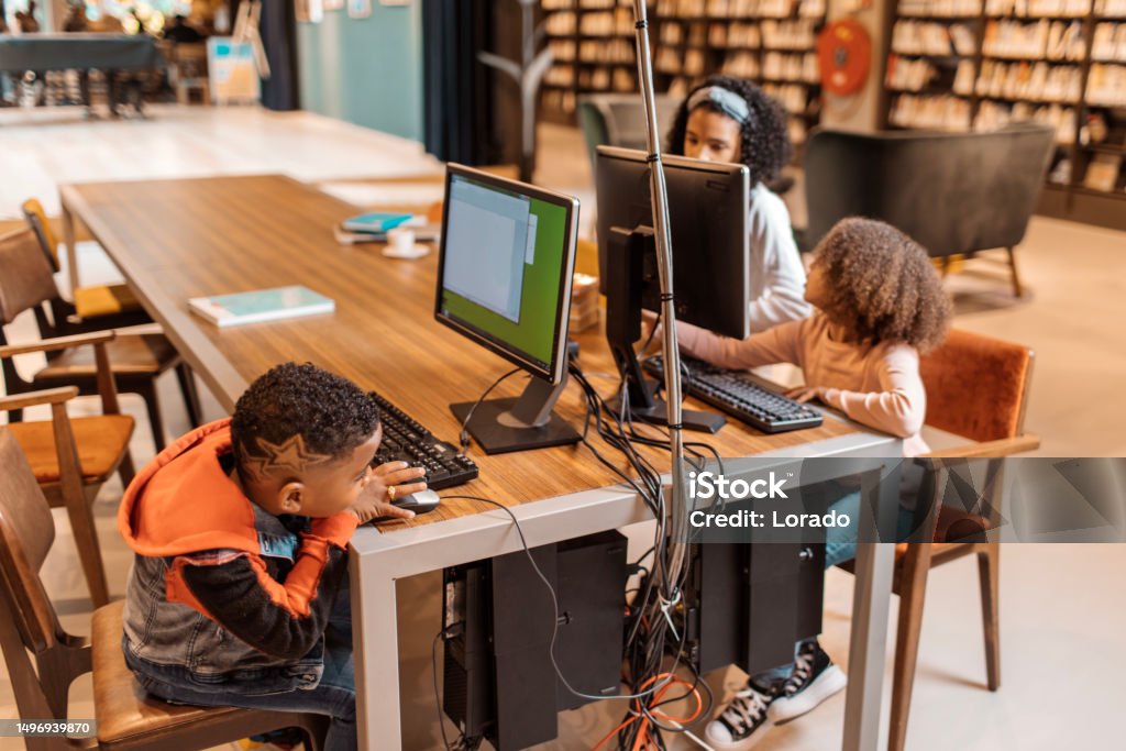 Children's Library Computer Three Young Black Readers Using A Computer In A Library Stock Photo ...