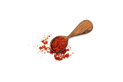 Top view of white bowl full of paprika