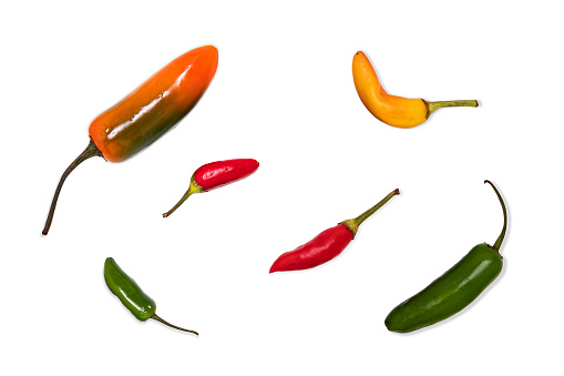 Green and red hot chili peppers isolated on white background