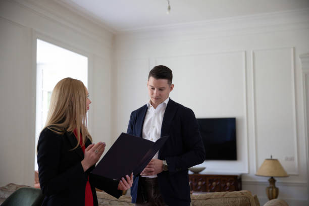 istock Estate agent lists final agreed details of ownership change 1496941606