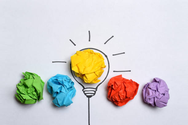 istock Creative flat lay composition with colorful paper balls on white background. Idea concept 1496942335