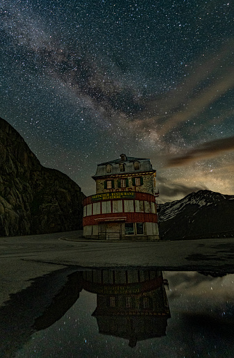 Furka pass in switzerland with milky way and swiss alps