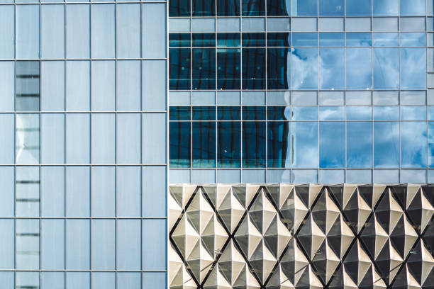 istock Modern office exterior facade close-up reflecting buildings and environment and forming unique complex pattern 1496944038