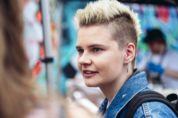 istock Candid portrait of young Londoner with half-shaved hairstyle 1496944607