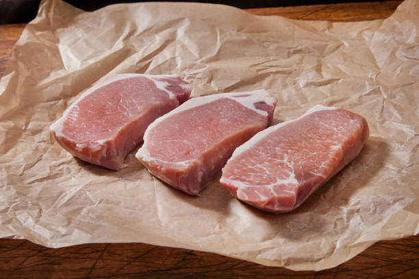 istock Seasoning Raw Boneless Pork Loin Chops 1496945538