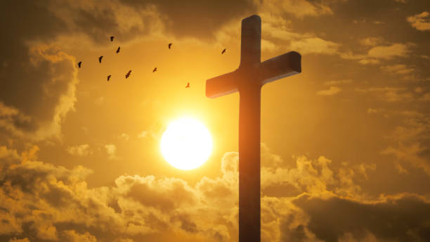 istock Good Friday concept. Cross in arm on sky background. 1496948200