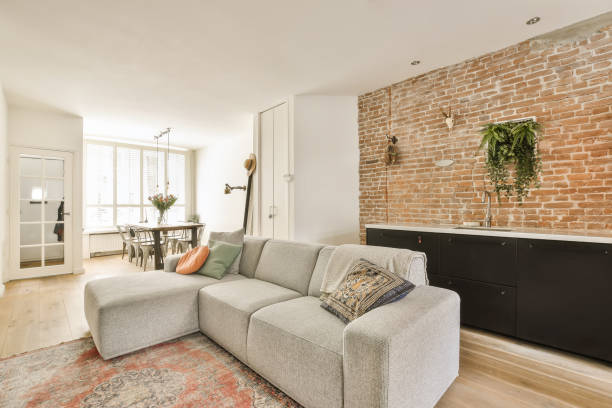 istock a living room with a couch and a brick wall 1496949887