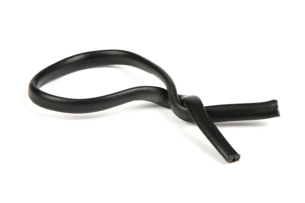 istock Black plastic coated wire tie used for a variety of things isolated on white background. Side view. 1496950164