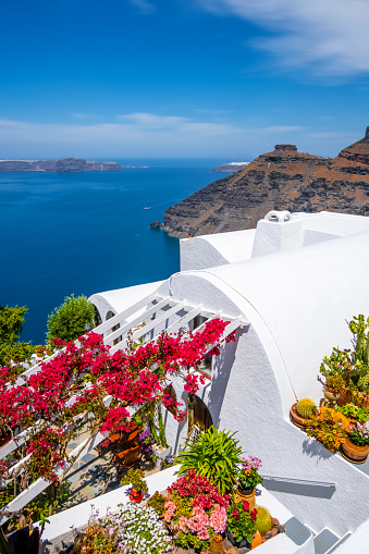 Santorini Island, Greece with traditional white houses and churches over the caldera and Aegean sea.