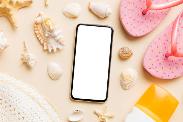 istock Flat lay composition with Phone and beach accessories on colored background. Smartphone with blank screen mock up with copy space 1496954266