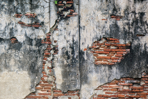 Close up abstract background image of Ancient Buddhist temple concrete wall in Ayuthaya, Thailand