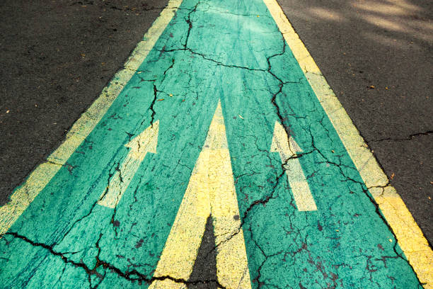 istock Merging roads with arrow signs 1496956746