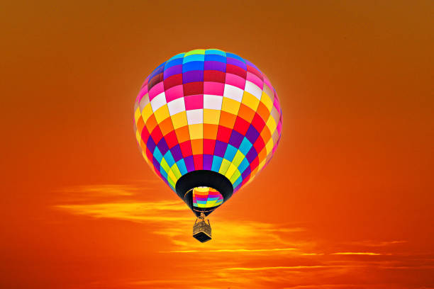 istock Hot air balloon flight over the sky at sunset 1496957828