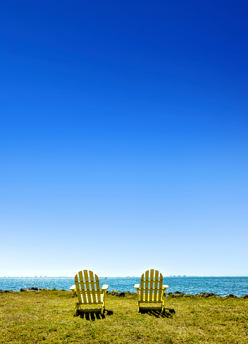 Outdoor chairs on green landscape in Florida