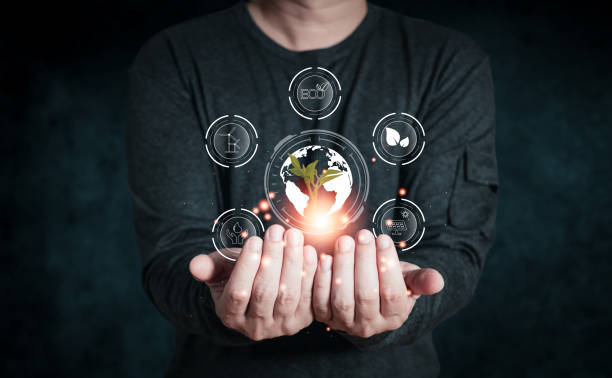 istock human are raising the planet to save energy,and reduce global warming,idea for environment conscious business,carbon credit,reducing greenhouse gas emissions,ESG for Environment Social and Governance 1496958812