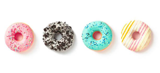 istock Four sweet donuts in colored glaze top view on a white background 1496960505