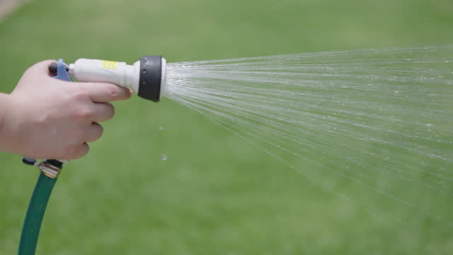 High pressure watering spray to water grass lawn