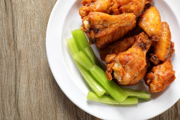 istock Fried chicken wings plate on wooden table 1496961230