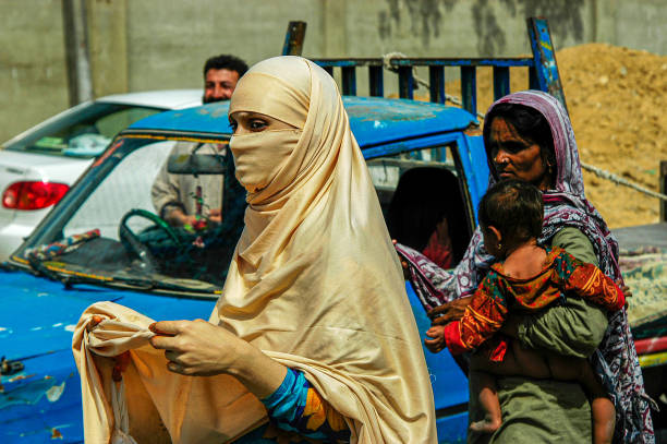 Pakistan, Karachi - March 25, 2005: Women begging in Pakistan