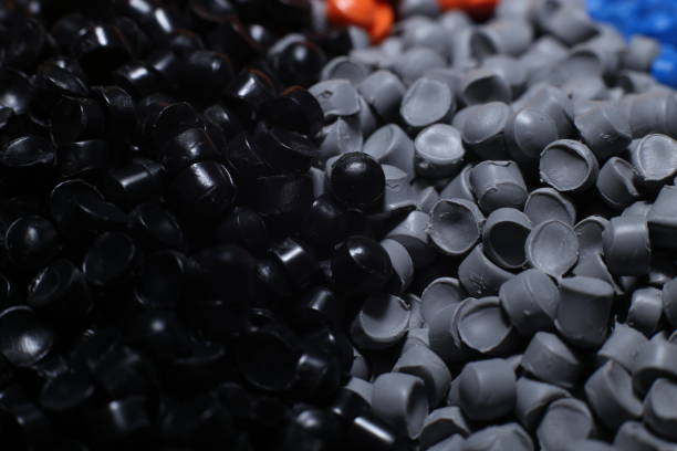 istock Grey and black of plastic polymer granules for background. 1496963477