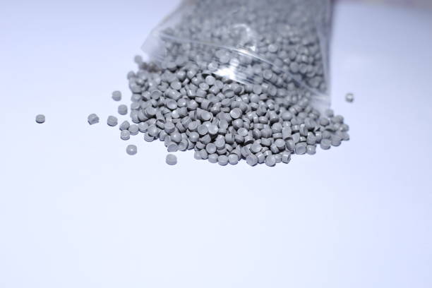 istock Grey of plastic polymer granules on white background. 1496963591