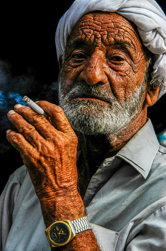 Pakistan, Karachi - March 25, 2005: Portrait of old coachman