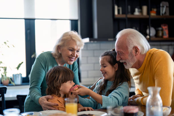 istock Two smiling kids having donuts for dessert after breakfast 1496965961