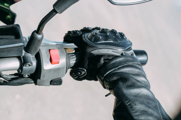 istock Protective moto gloves, safety gear close-up on brake handle 1496966208