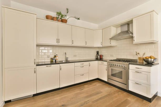 istock a kitchen with white cabinets and a stainless steel oven 1496966407
