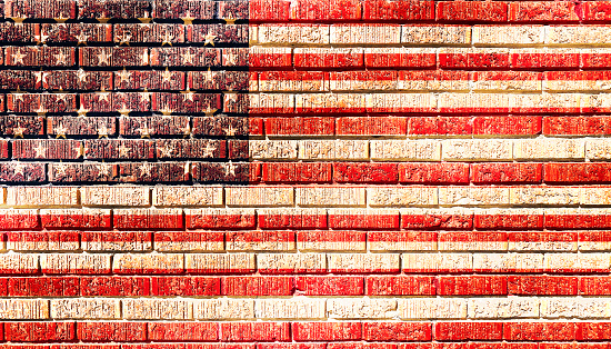 a brick wall american flag painted vintage retro faded america usa weathered