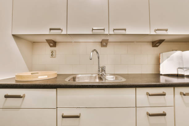 istock a kitchen with white cabinets and a sink 1496969626