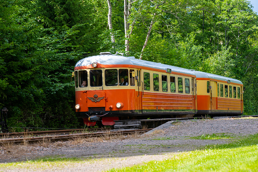 Alingsas, Sweden - July 02 2022: Museum railbus between Anten and Gräfsnäs passing through picturesque scenery.