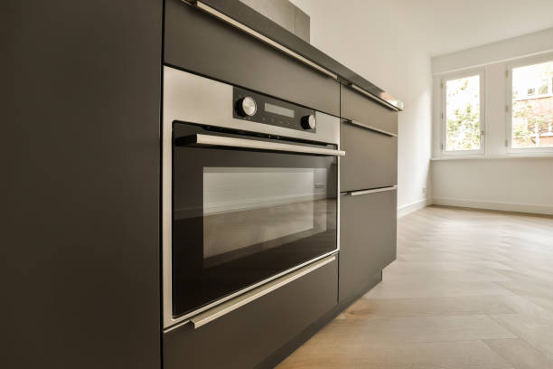 istock a black oven in a kitchen with a wood floor 1496970589