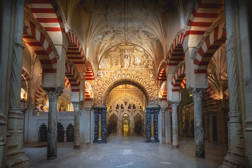 Cordoba, Spain - Jun 10, 2019: Arch with Christian Elements at Al-Hakam II Expasion area of Mosque–Cathedral of Cordoba - Cordoba, Andalusia, Spain