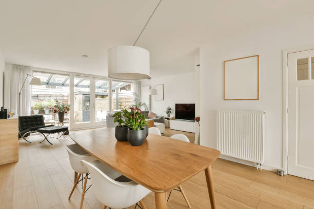 istock a dining room with a wooden table and white chairs 1496974885